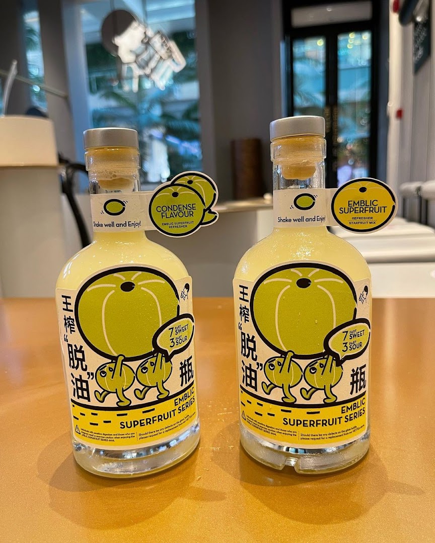 Two HEYTEA Emblic Superfruit Series bottled drinks, one 'Condense Flavour' and one 'Starfruit Mix'.