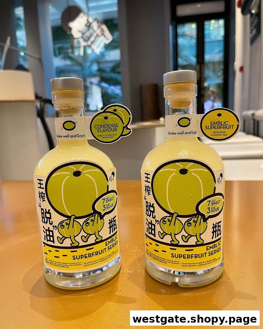 Two HEYTEA Emblic Superfruit Series bottled drinks, one 'Condense Flavour' and one 'Starfruit Mix'.