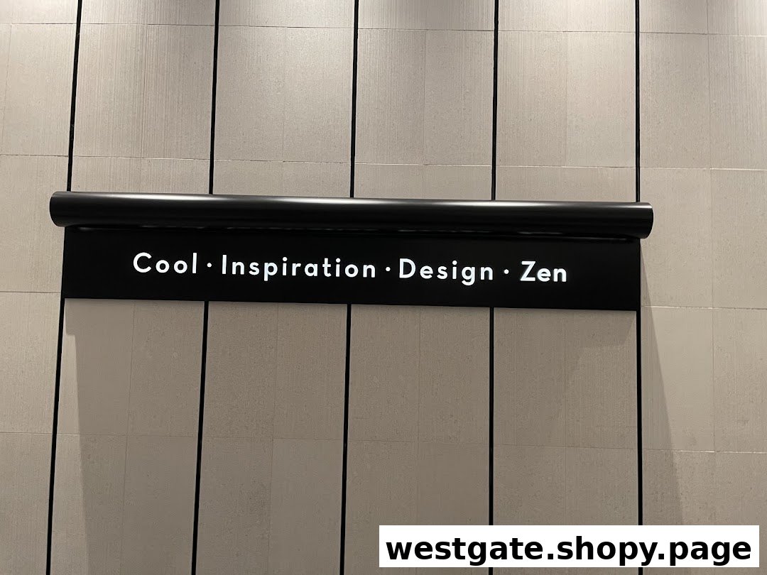 A black sign with white text 'Cool • Inspiration • Design • Zen' on a light-colored tiled wall.