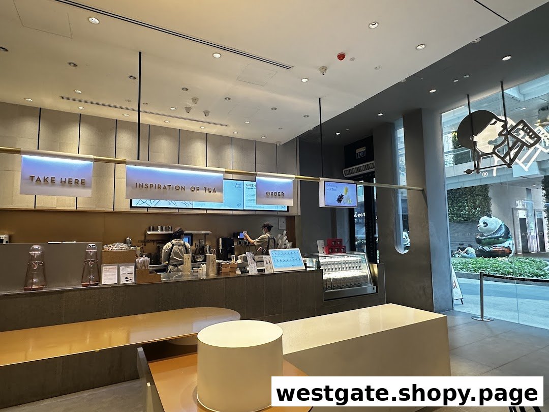 Interior view of HEYTEA's modern counter with staff preparing drinks and digital order screens.