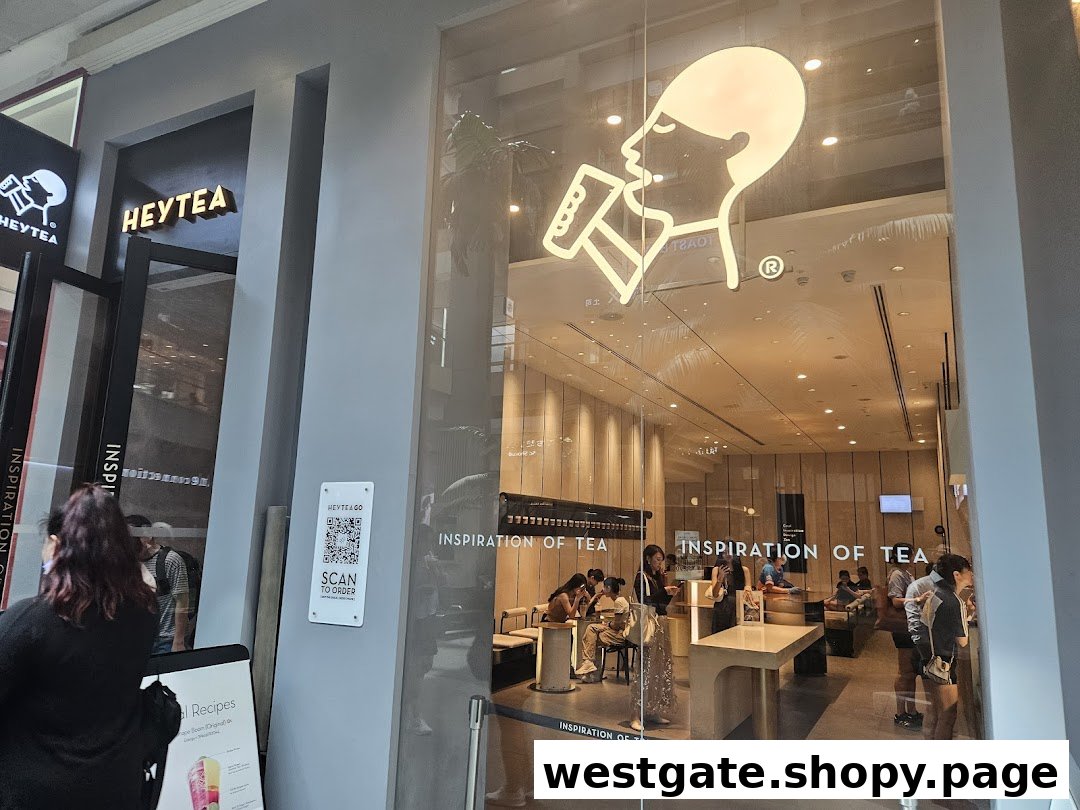 The modern storefront of HEYTEA Westgate, showcasing its inviting interior and iconic logo.