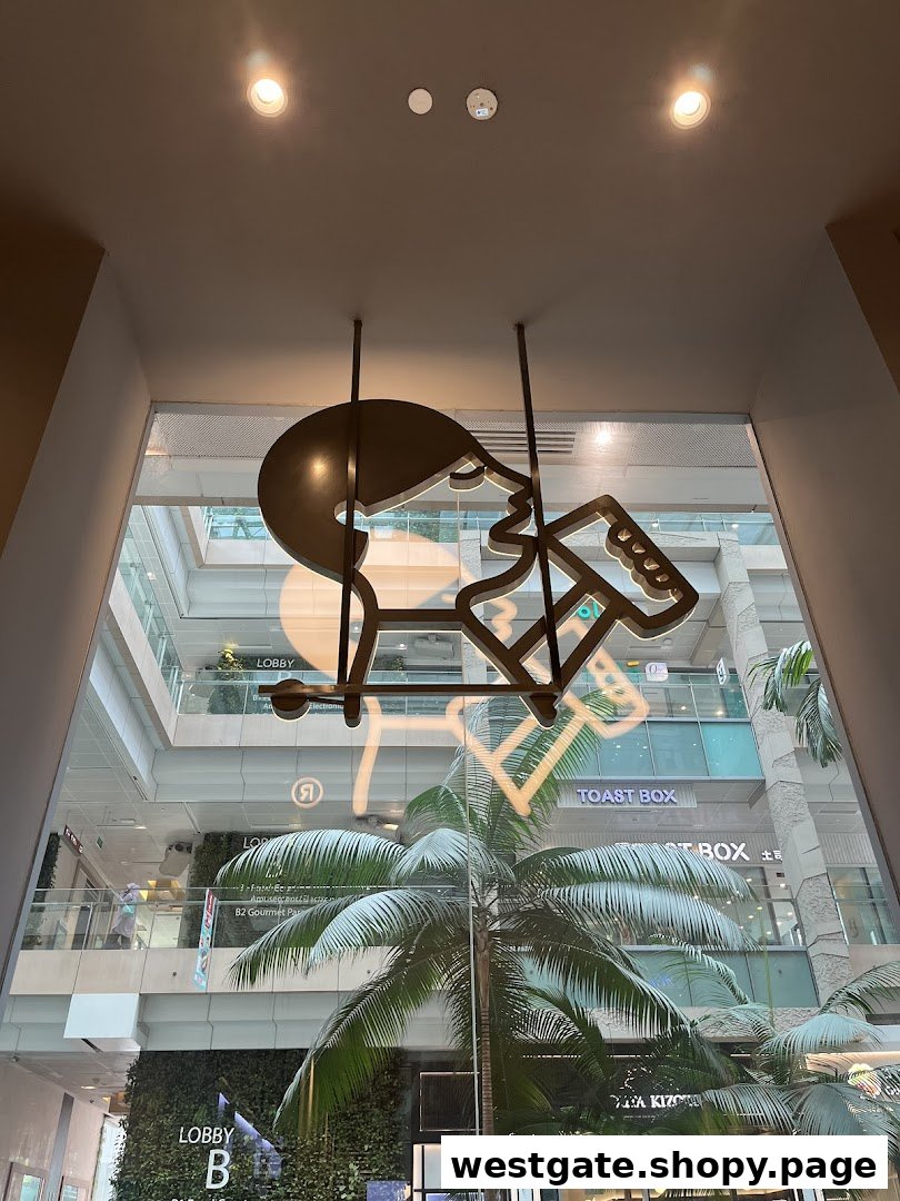 View from inside HEYTEA, showcasing the mall atrium with a unique decorative art piece.