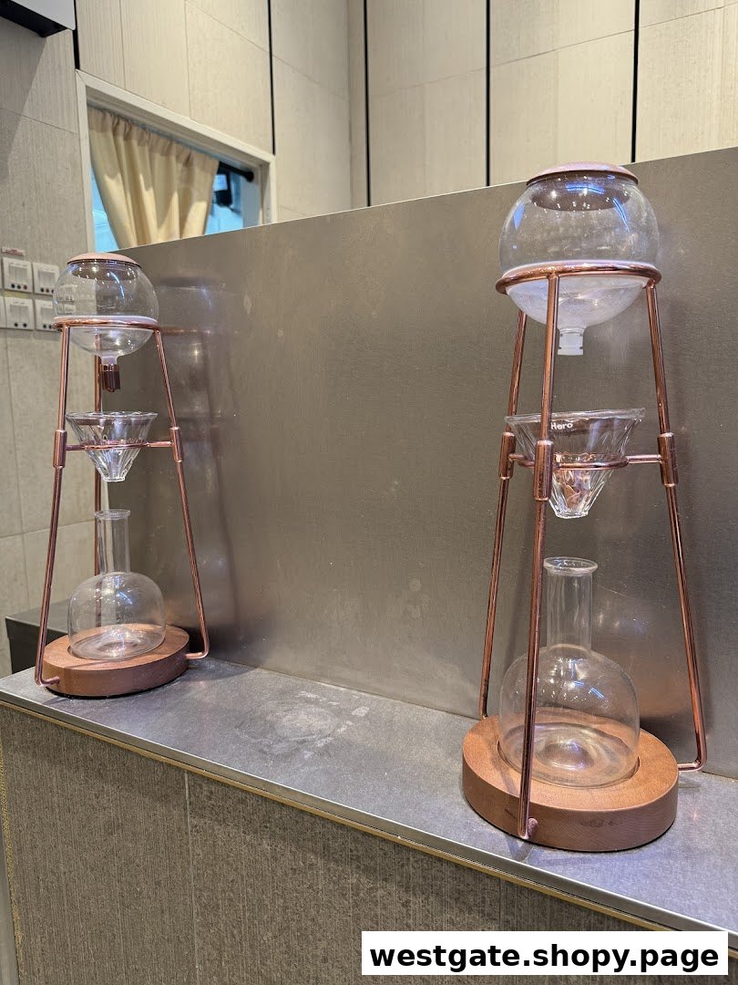 Two elegant cold brew coffee drippers displayed inside HEYTEA Westgate.