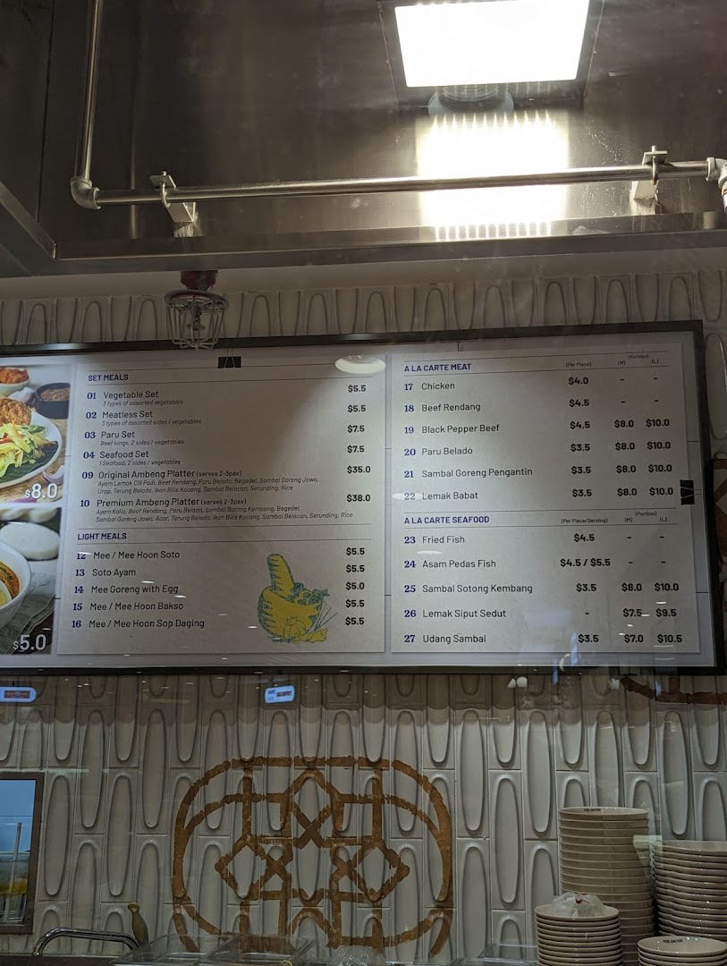 A digital menu board displaying various Malay and Indonesian set meals, light meals, and à la carte dishes.