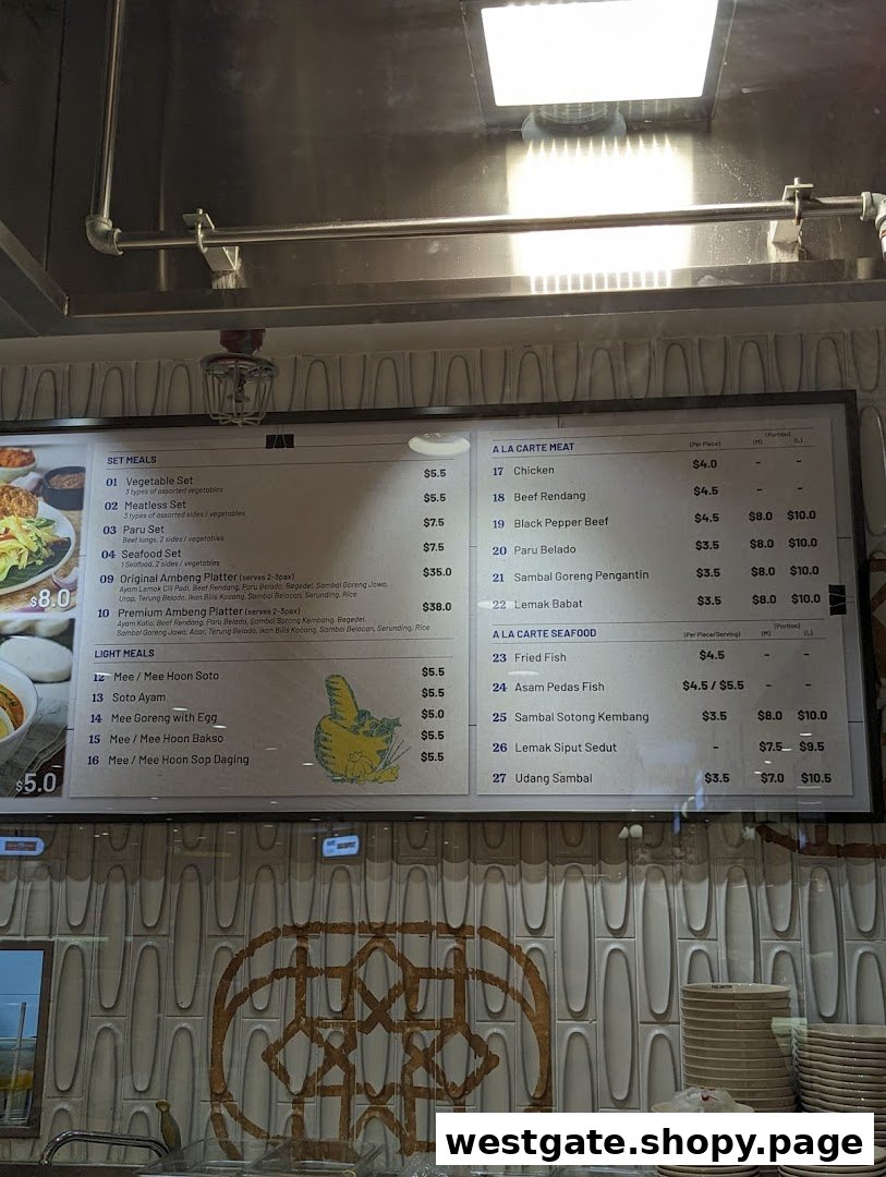 A digital menu board displaying various Malay and Indonesian set meals, light meals, and à la carte dishes.