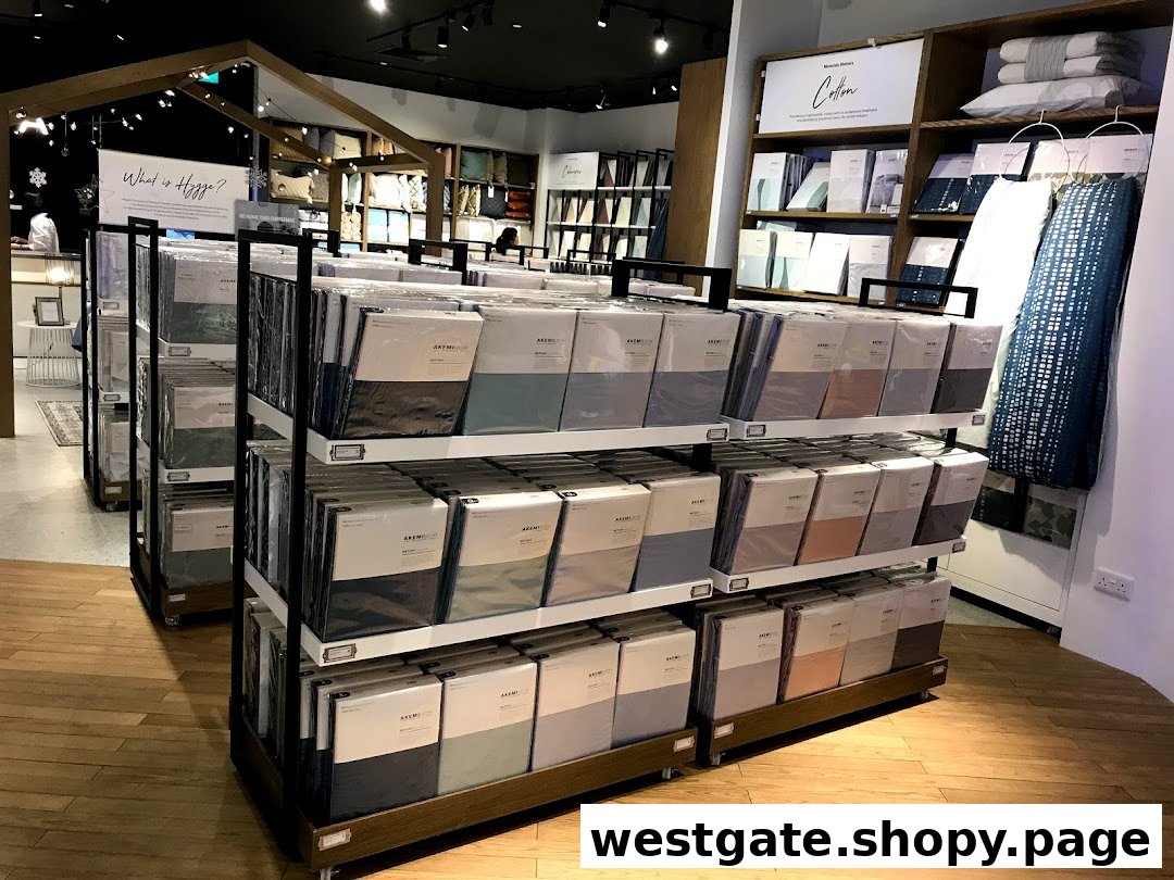 Interior view of HOOGA Westgate, showcasing neatly arranged bedding and home textile products in a warm, inviting setting.