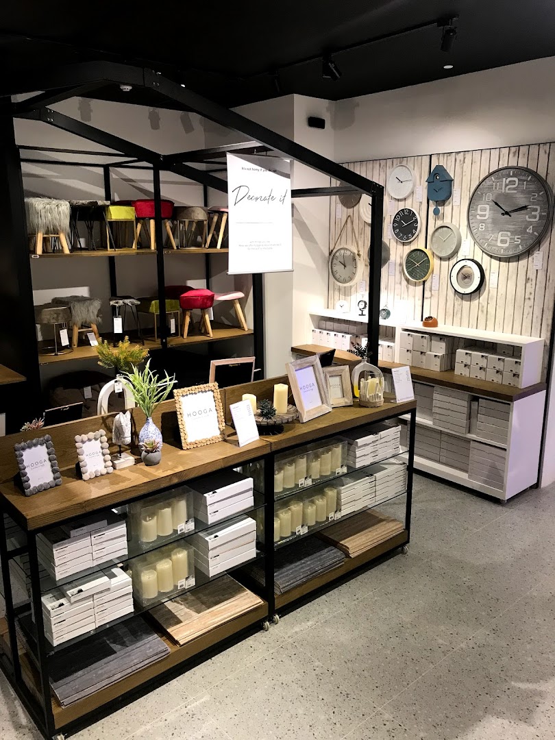 Interior view of HOOGA showcasing home decor, furniture, and lifestyle products on display.