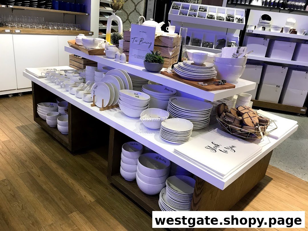 A display of elegant white dinnerware, bowls, and home accessories in a modern retail setting.