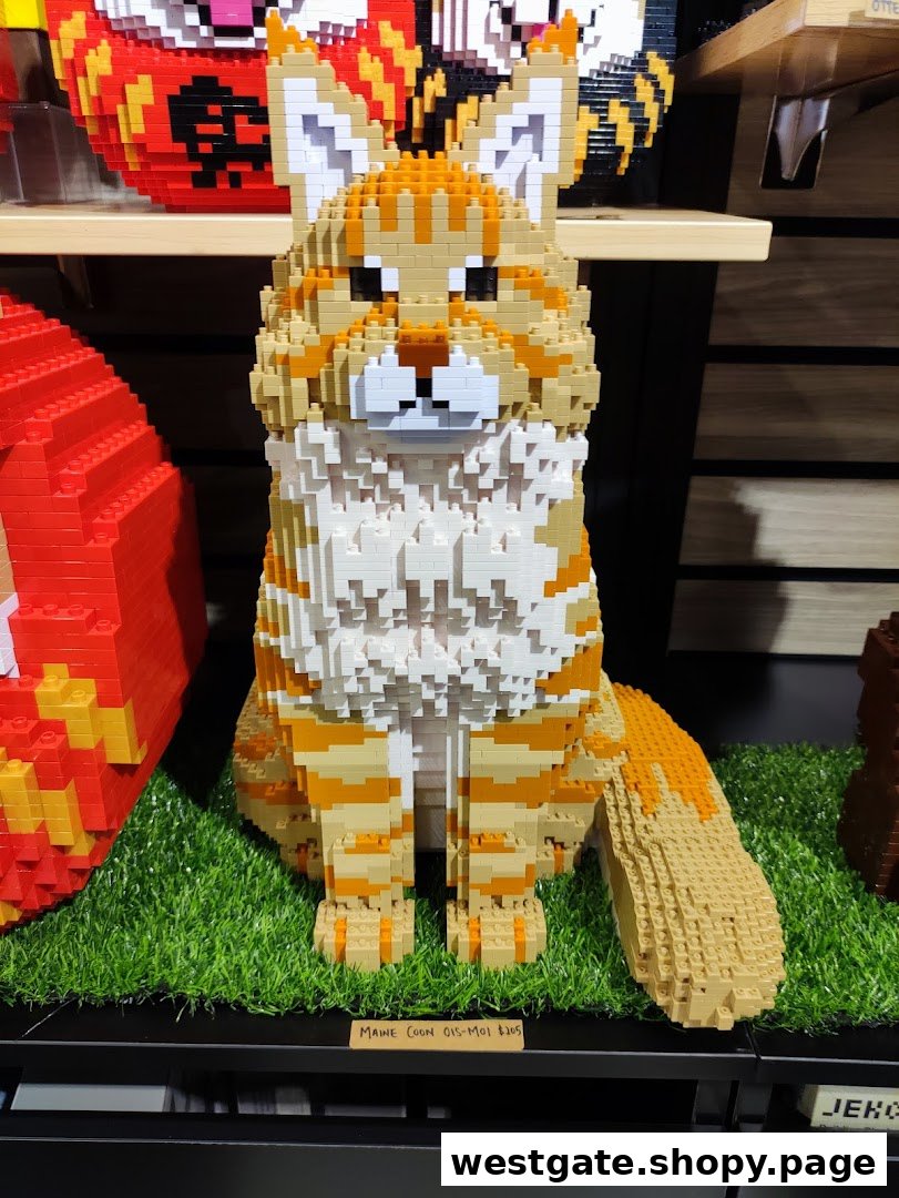A detailed Maine Coon cat sculpture made from building blocks, displayed on artificial grass.