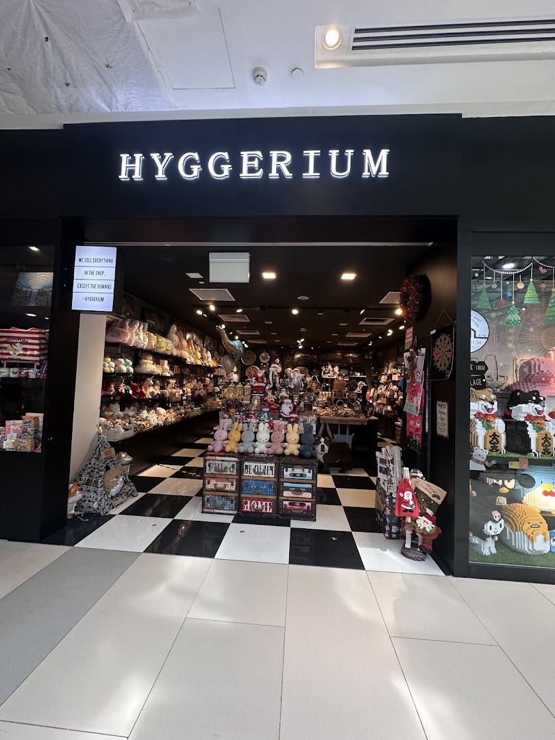 The shopfront of Hyggerium, a novelty and gift store, showcasing a wide array of plush toys and unique items.