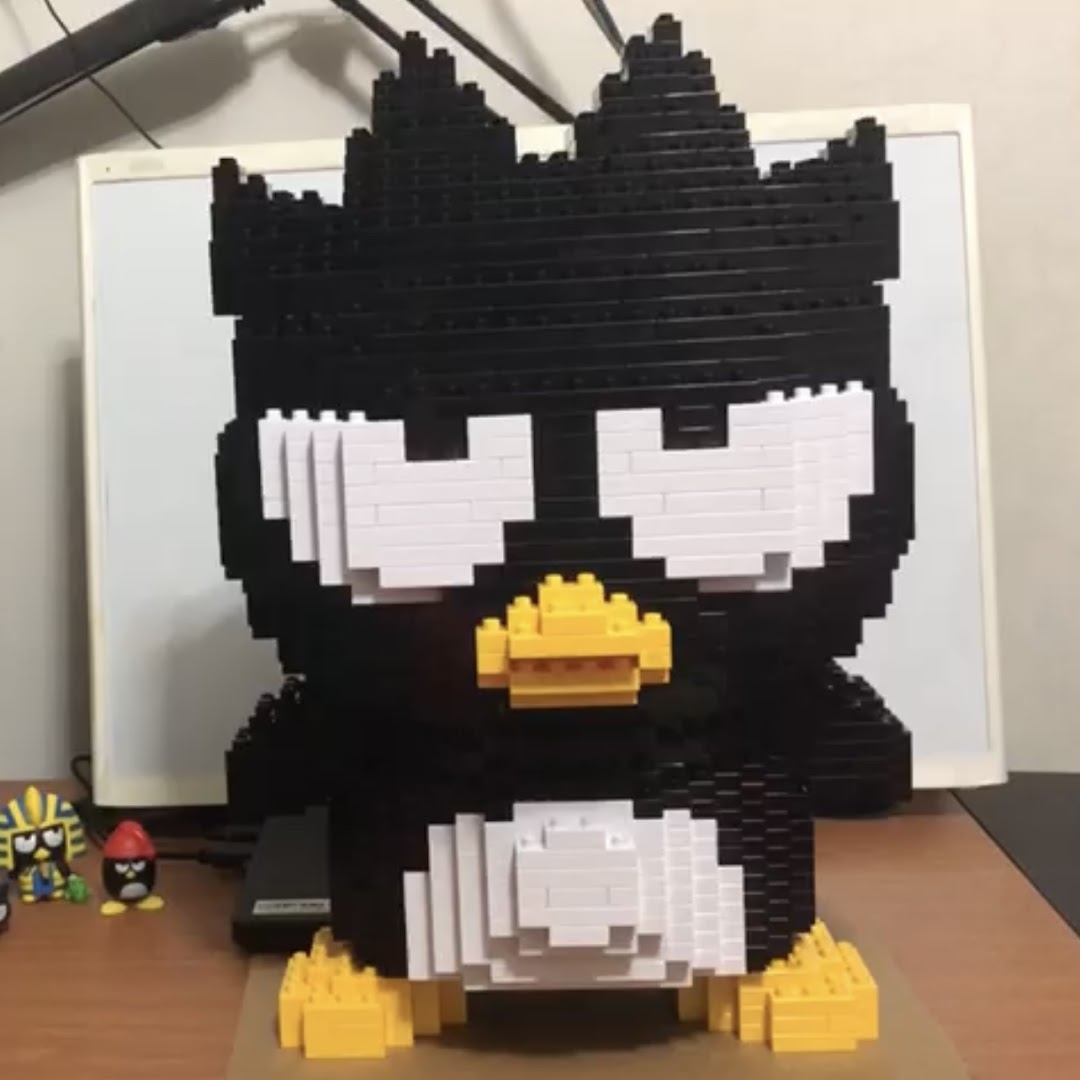 A large, detailed brick-built Badtz-Maru character display, showcasing creative building toys.