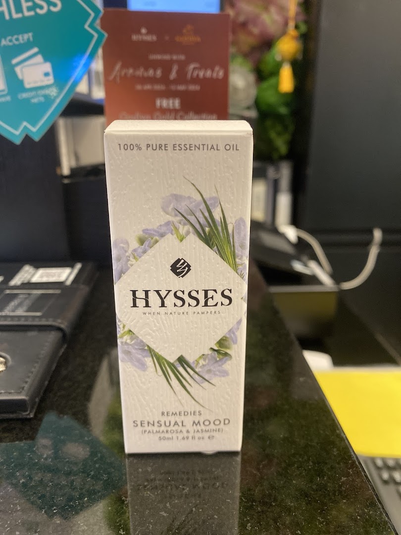 A Hysses 'Sensual Mood' essential oil box sits on a retail counter.