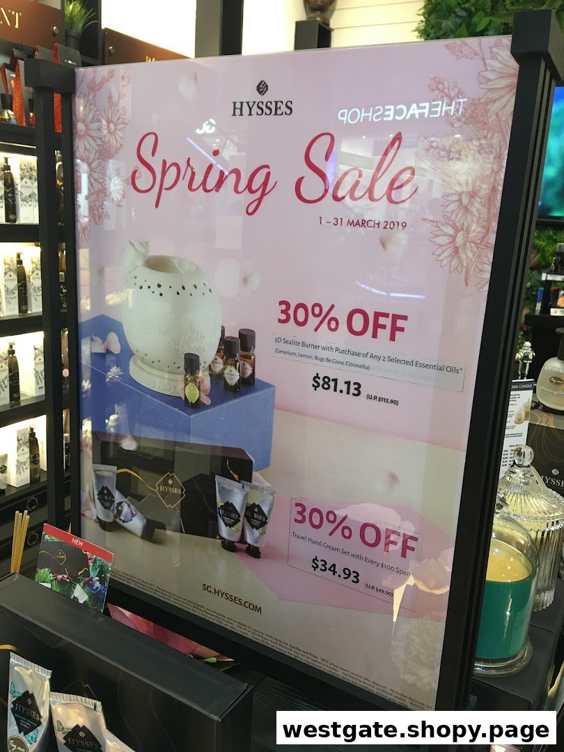 A promotional display board for HYSSES' Spring Sale featuring essential oils and hand cream offers.