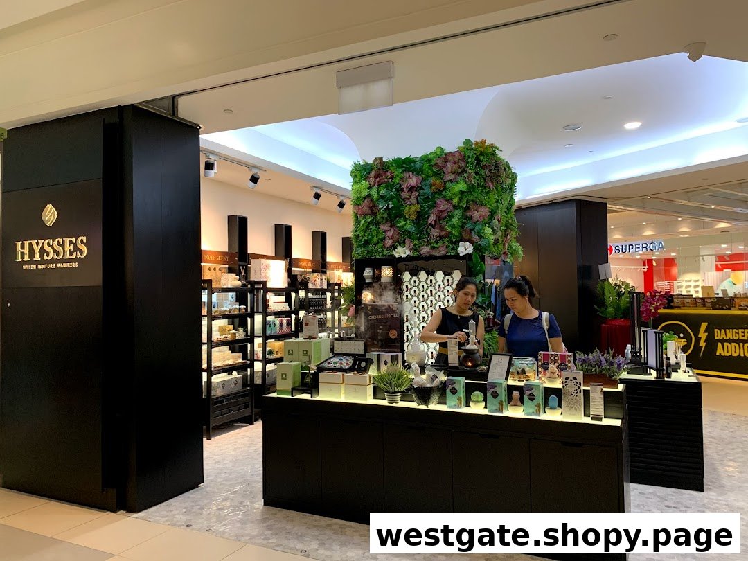 Two women interact with products inside the HYSSES shop, featuring home scents and wellness items.