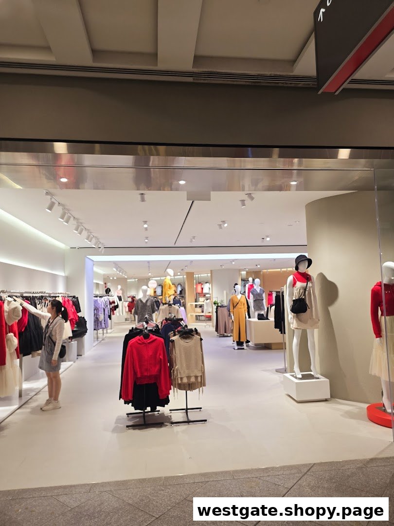 The inviting entrance of a modern fashion boutique, showcasing stylish apparel on mannequins and racks.