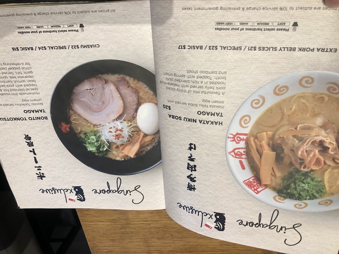 A detailed view of Ippudo's ramen menu, showcasing signature dishes and add-ons with descriptions and prices.