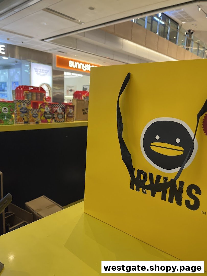 A bright yellow IRVINS shopping bag with the brand's iconic duck logo, showcasing products in the background.