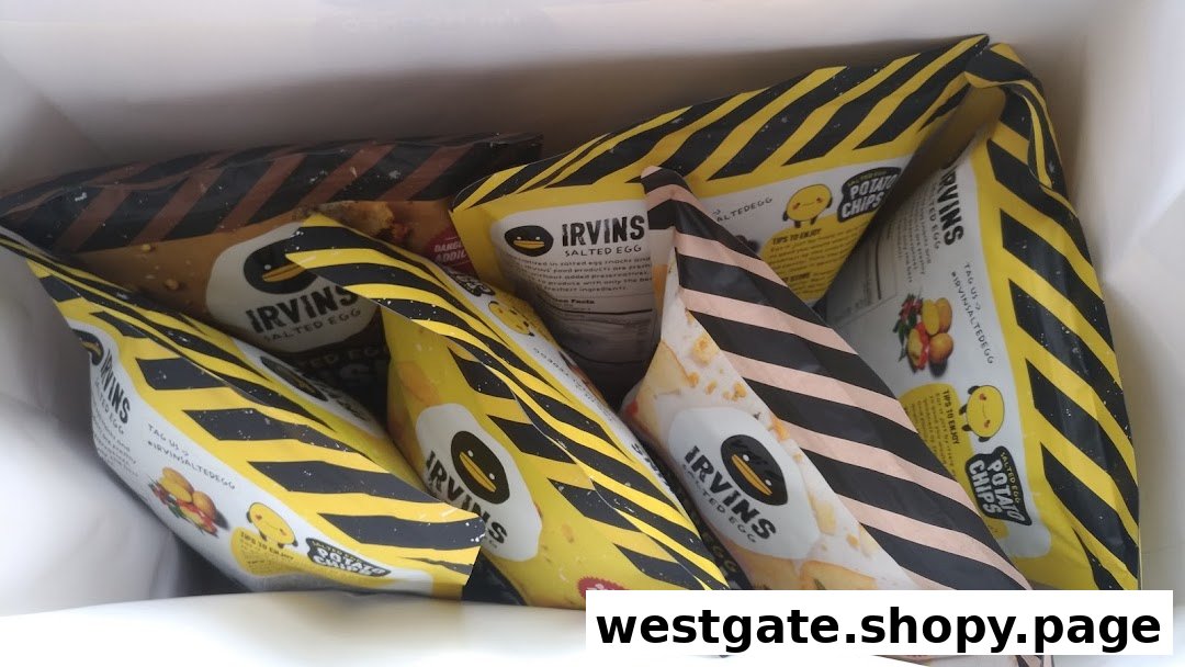 A close-up view of multiple Irvins Salted Egg snack bags inside a white shopping bag.