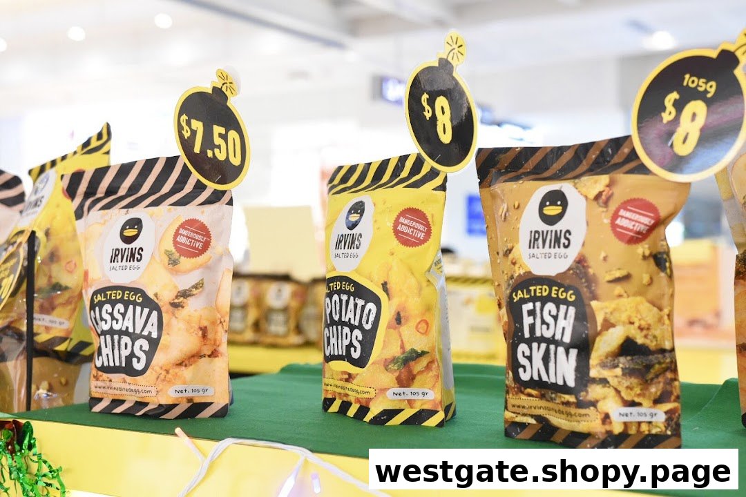 Close-up display of Irvins Salted Egg products, including Cassava Chips, Potato Chips, and Fish Skin, with prices.