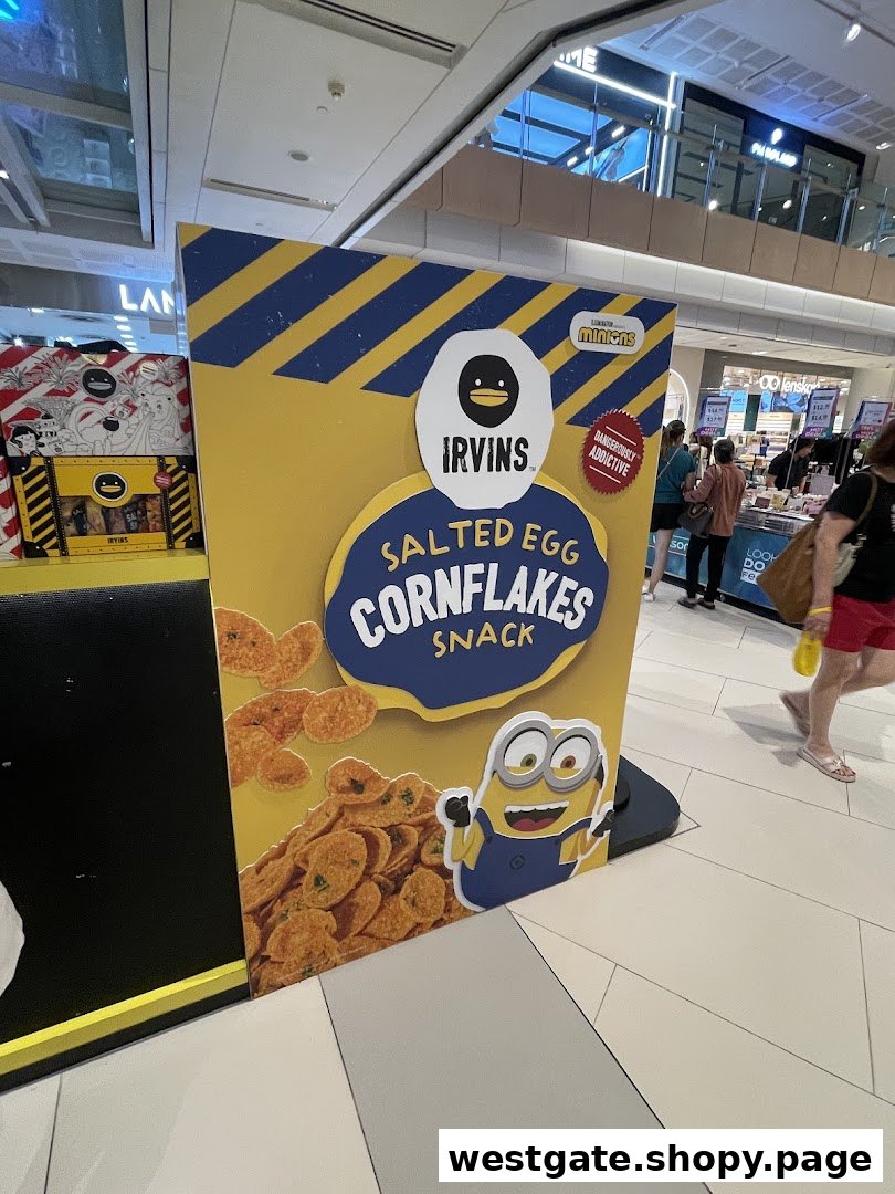 A large promotional display for IRVINS Salted Egg Cornflakes Snack featuring Minions.