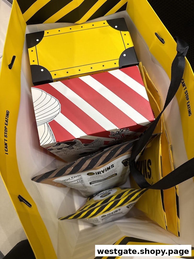 A shopping bag filled with IRVINS' signature salted egg yolk snacks and distinctive packaging.