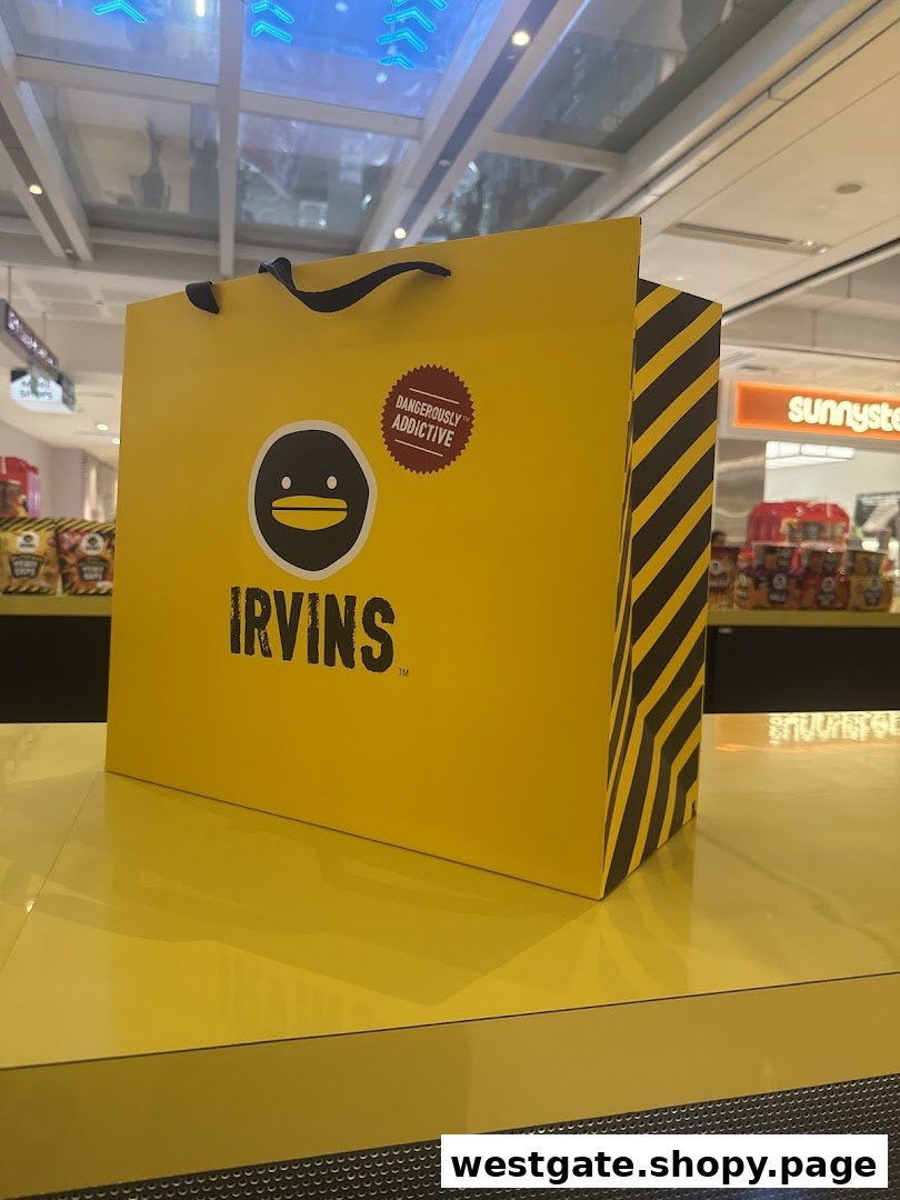 A bright yellow IRVINS shopping bag with its distinctive logo and 'Dangerously Addictive' slogan.