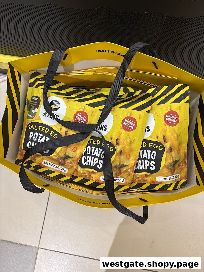 Several bags of IRVINS Salted Egg Potato Chips are seen inside a yellow shopping bag.