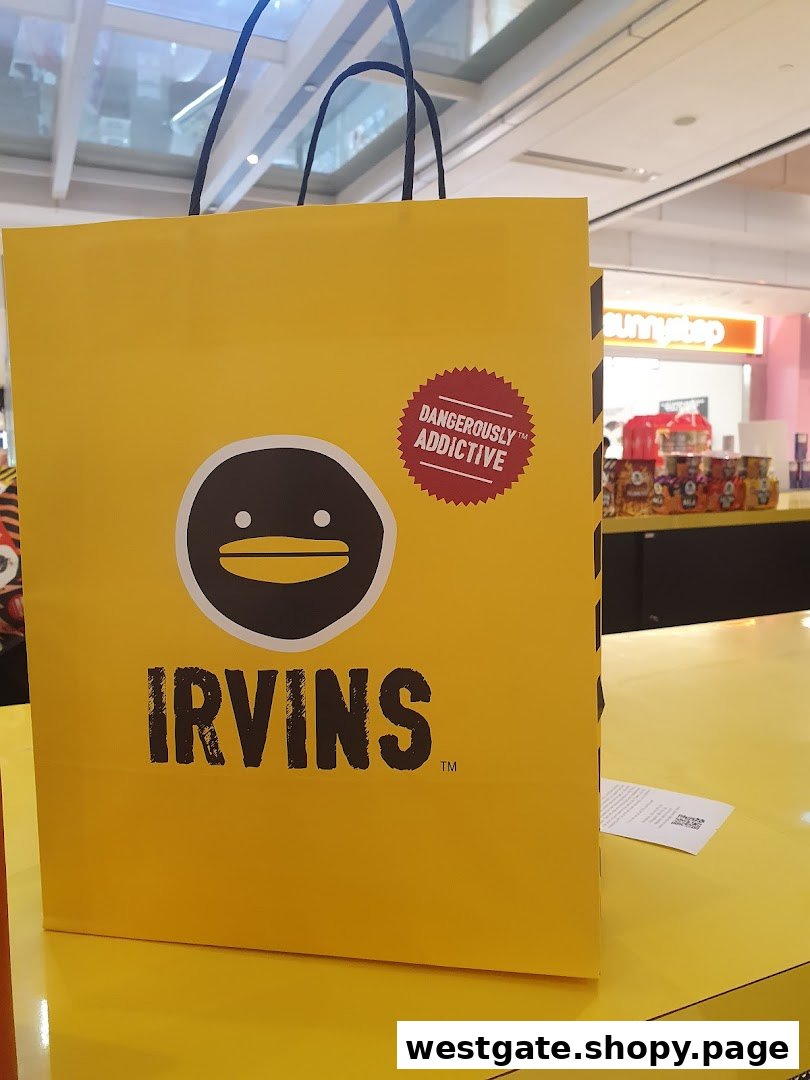 A bright yellow IRVINS shopping bag featuring its distinctive logo and 'Dangerously Addictive' slogan.