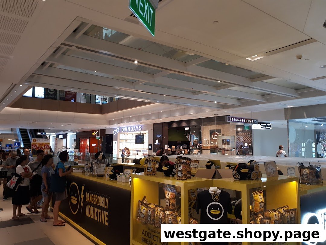 A bustling IRVINS kiosk in a shopping mall, showcasing their popular salted egg snacks and merchandise.