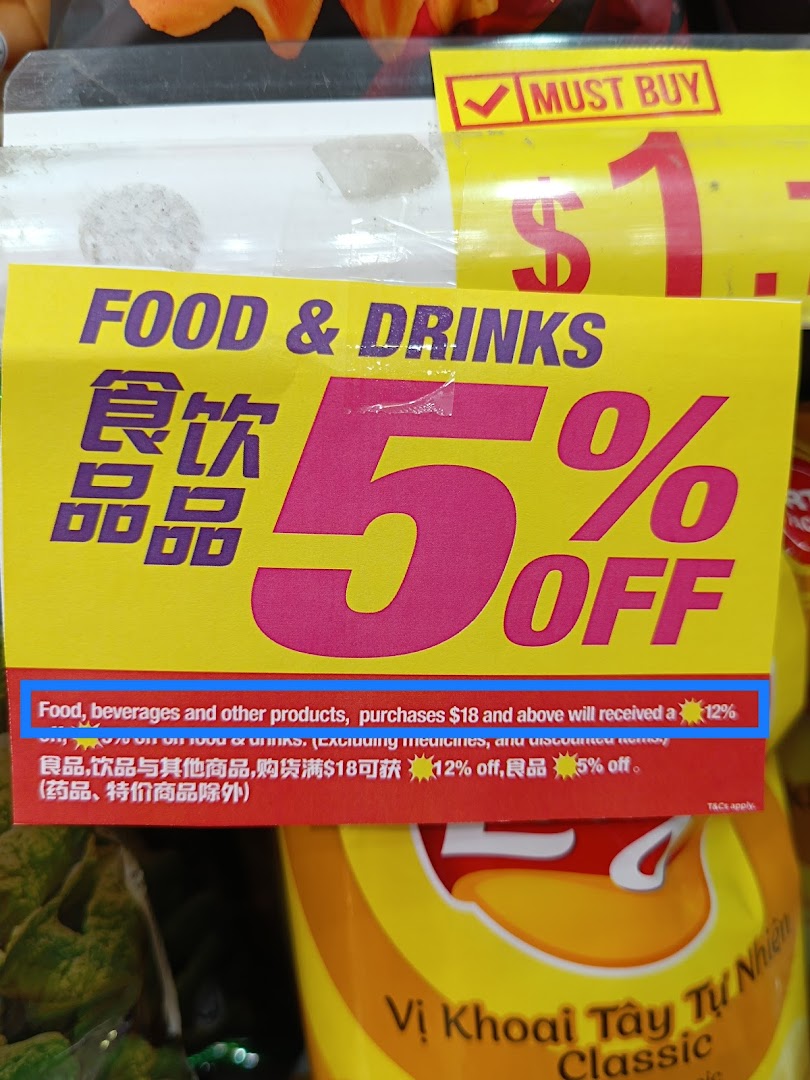 A close-up of a yellow promotional sign in Japan Home, advertising discounts on food and drinks.