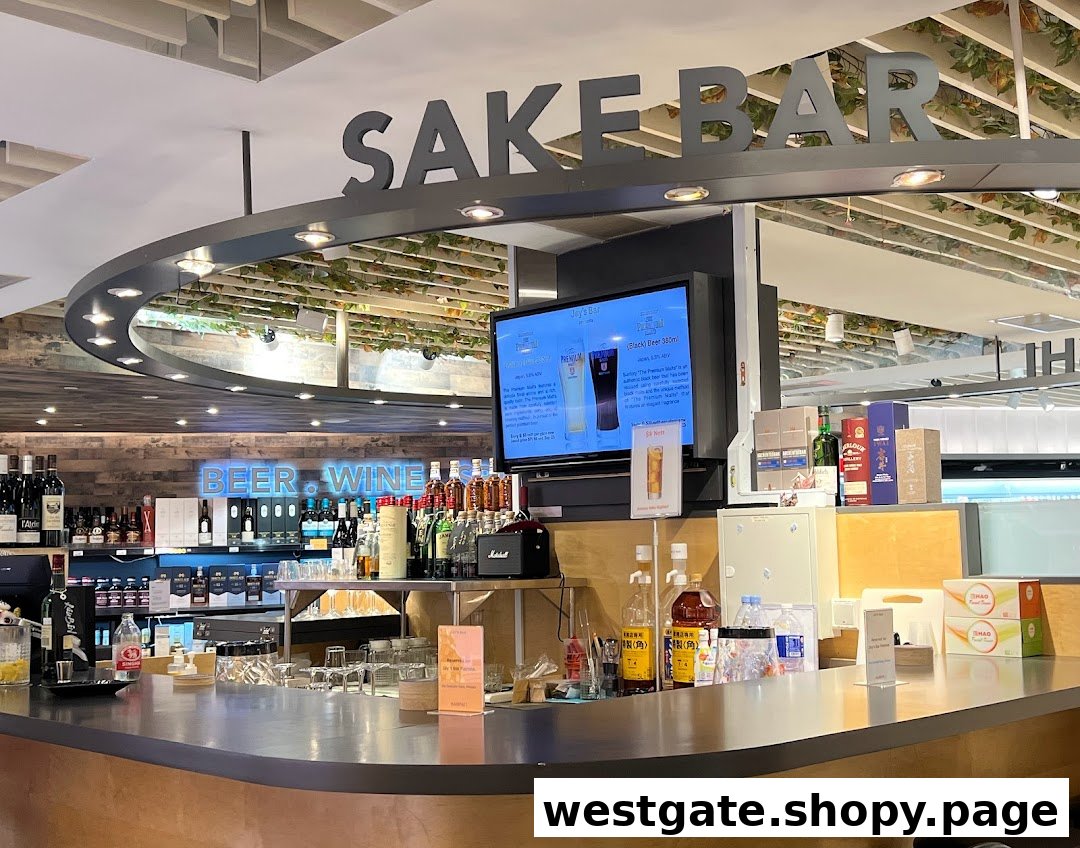 An inviting interior view of Jays Bar, featuring a well-stocked counter, Sake Bar sign, and digital display.