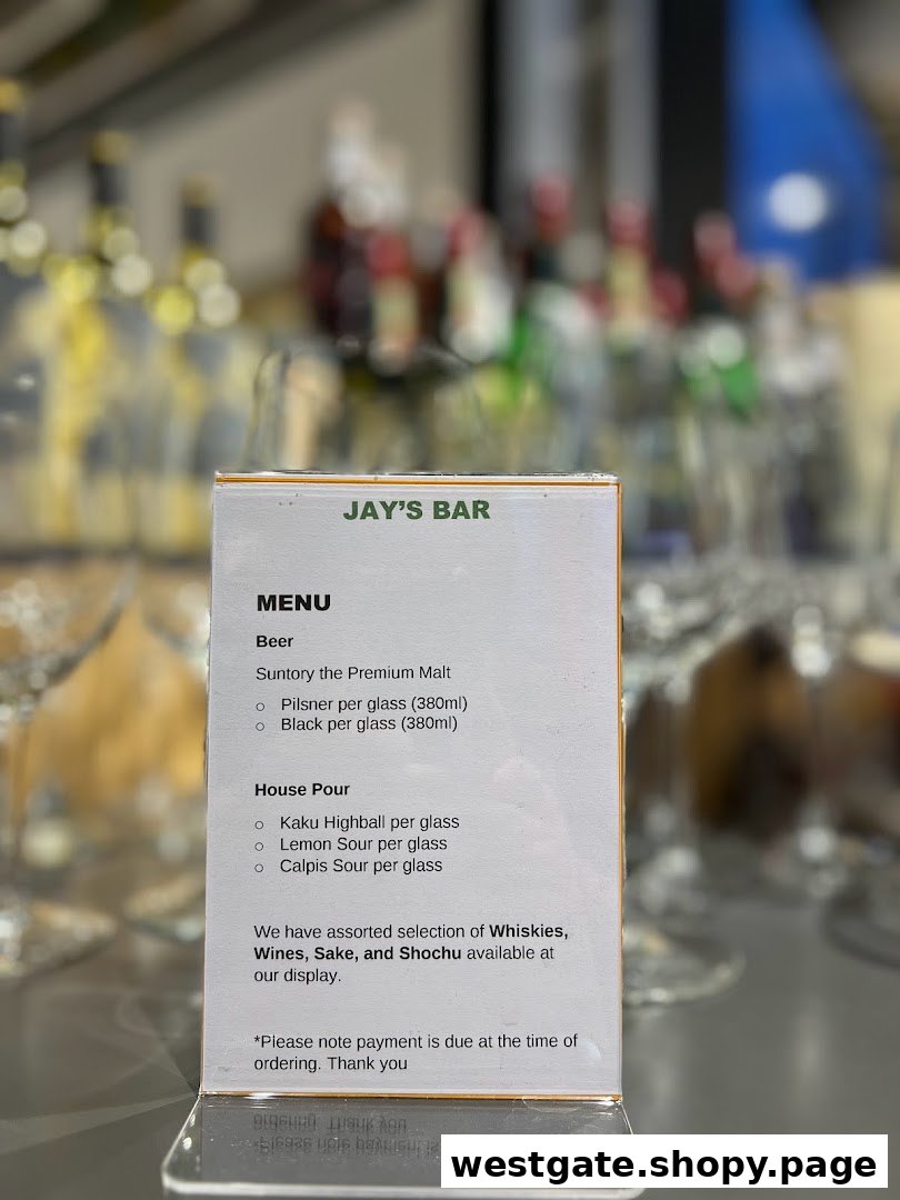 A close-up of Jay's Bar menu, featuring beer and house pour selections, with a blurred bar background.
