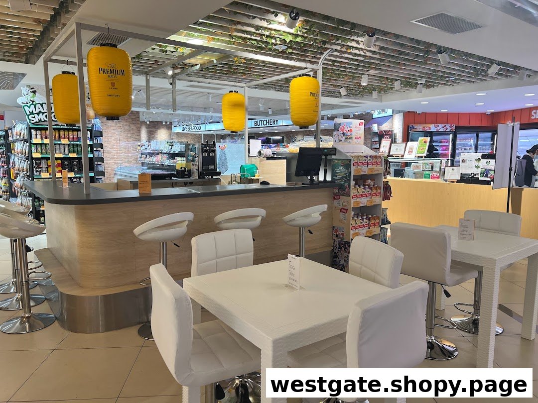 Modern food hall interior featuring a bar counter, comfortable seating, and diverse retail product displays.
