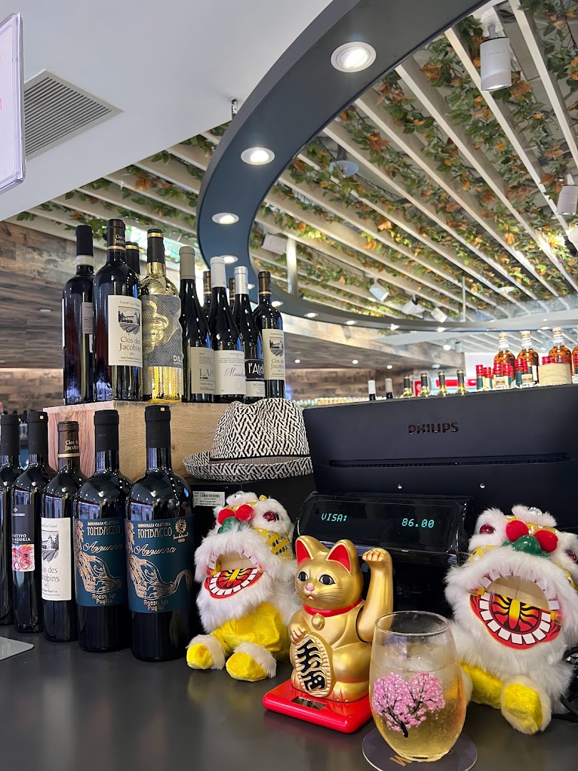 An inviting interior view of Jays Bar showcasing a selection of wine bottles and unique decor.