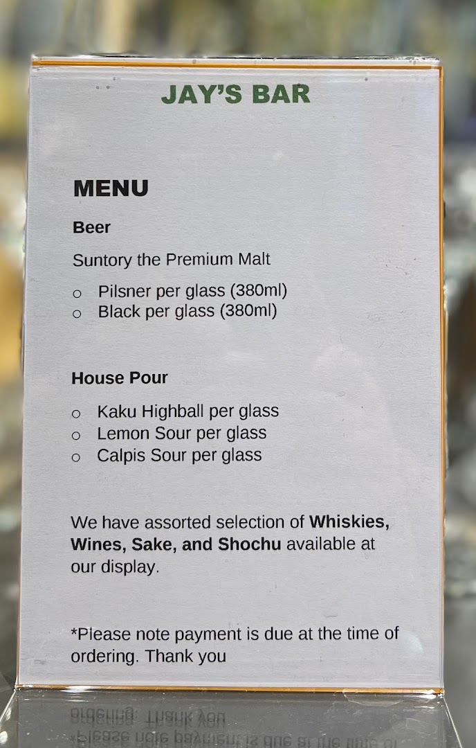 A menu board from Jay's Bar displaying beer and house pour selections.