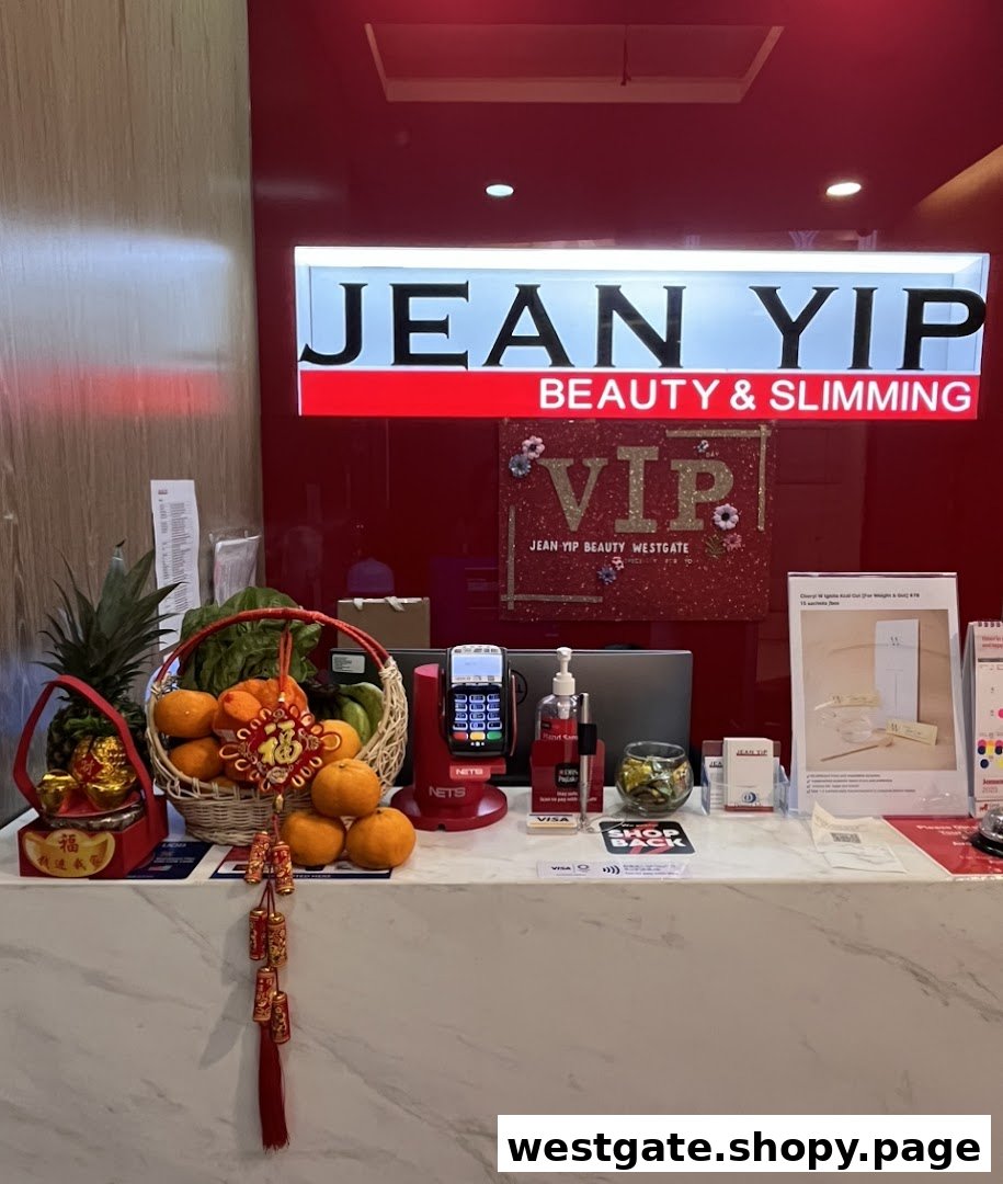 A reception counter at Jean Yip Beauty & Slimming, featuring festive decorations and a payment terminal.