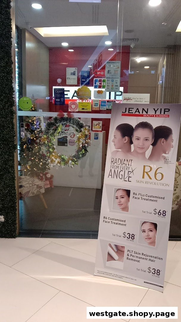 The shop front of Jean Yip Hairdressing and Hairspa, featuring a promotional stand and festive decorations.