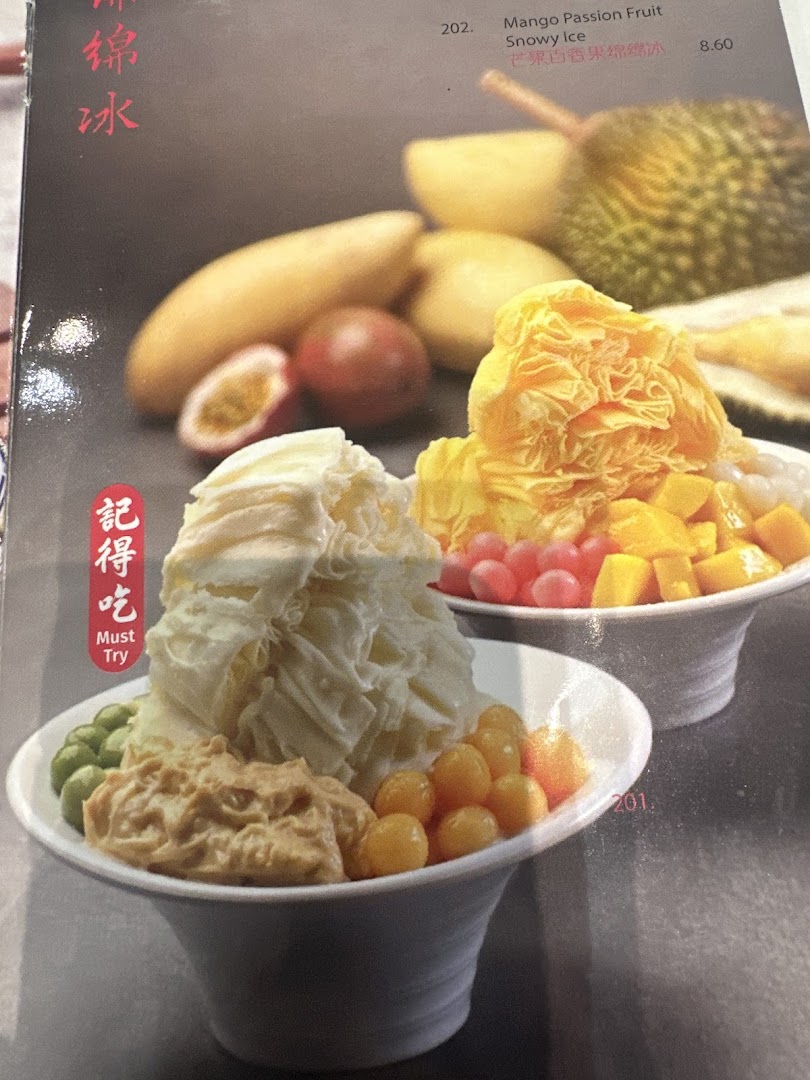 A menu page showcasing two bowls of refreshing snowy ice desserts with various fruit toppings.