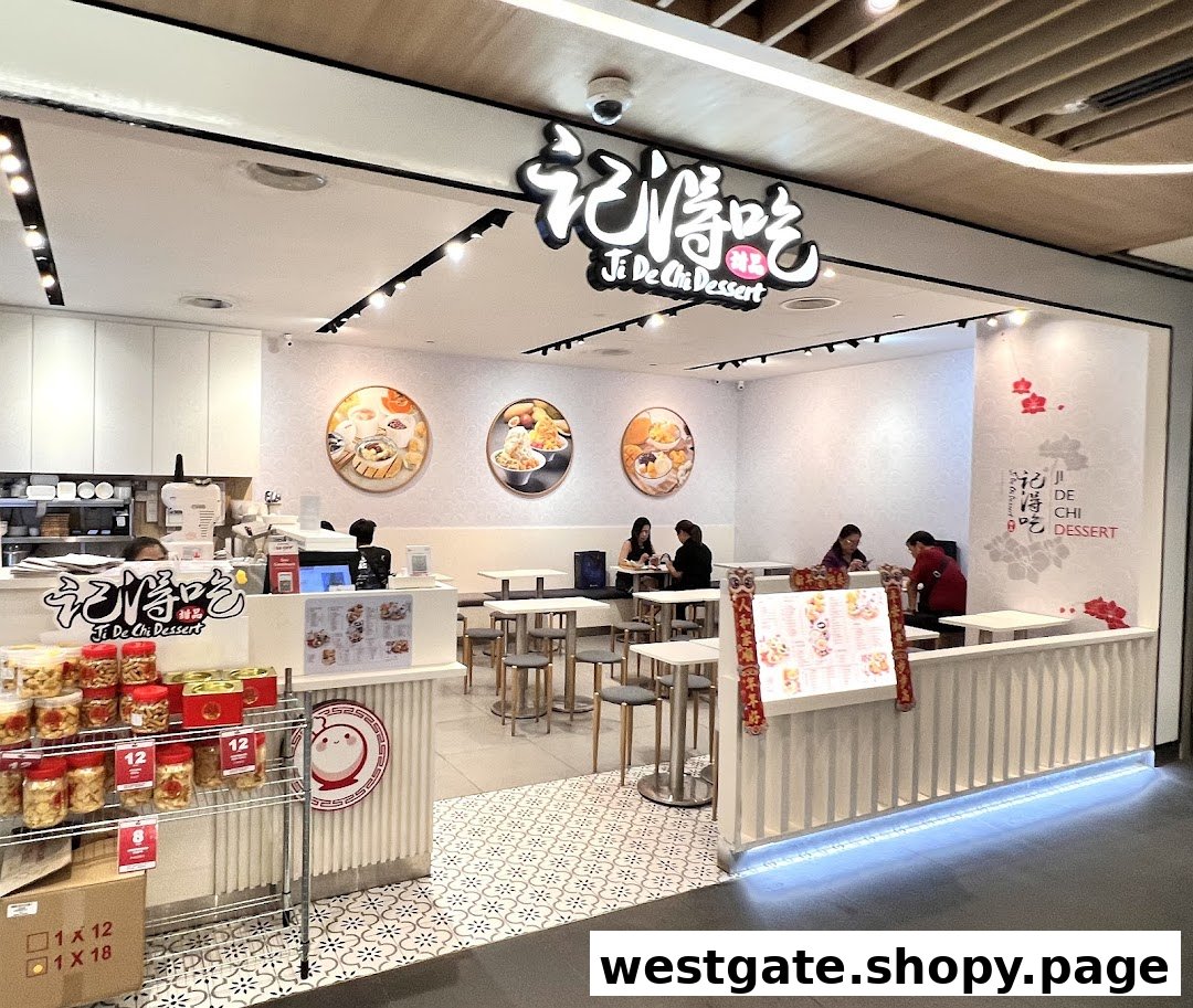 The brightly lit entrance and interior of Ji De Chi Dessert, featuring seating and a display of products.