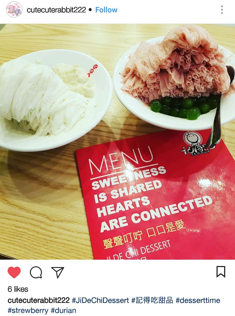 Two bowls of refreshing shaved ice desserts and a red menu cover from Ji De Chi Dessert.