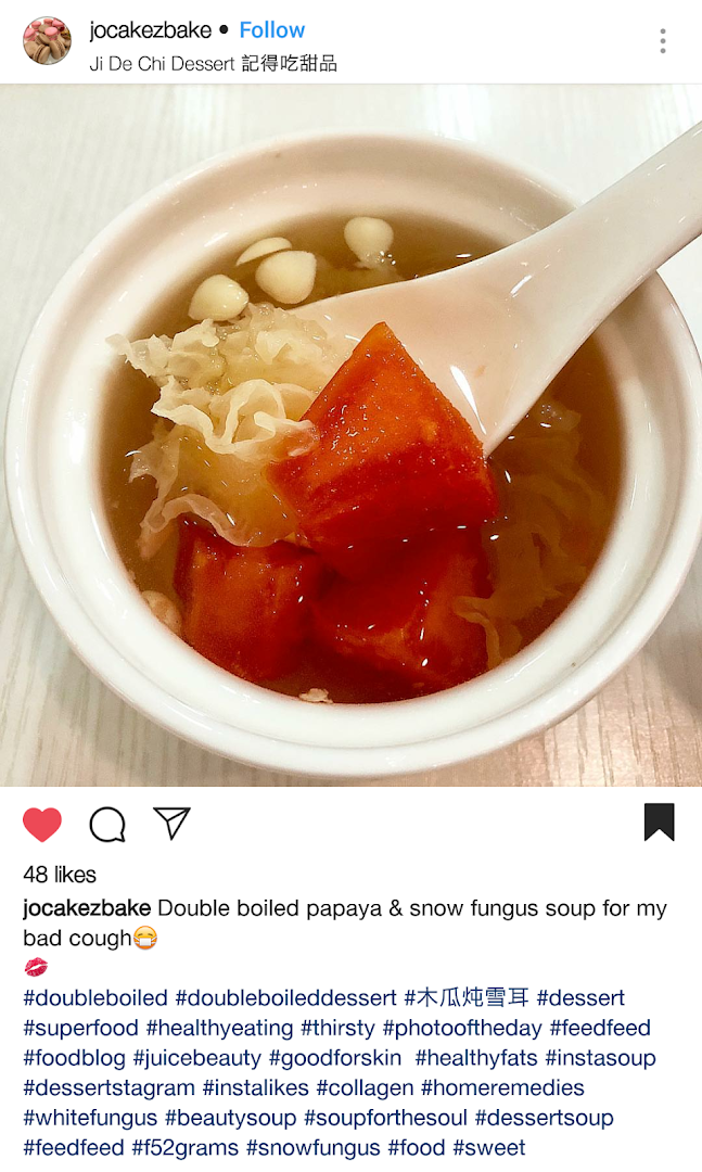 A close-up of a bowl of traditional double-boiled papaya and snow fungus dessert soup.