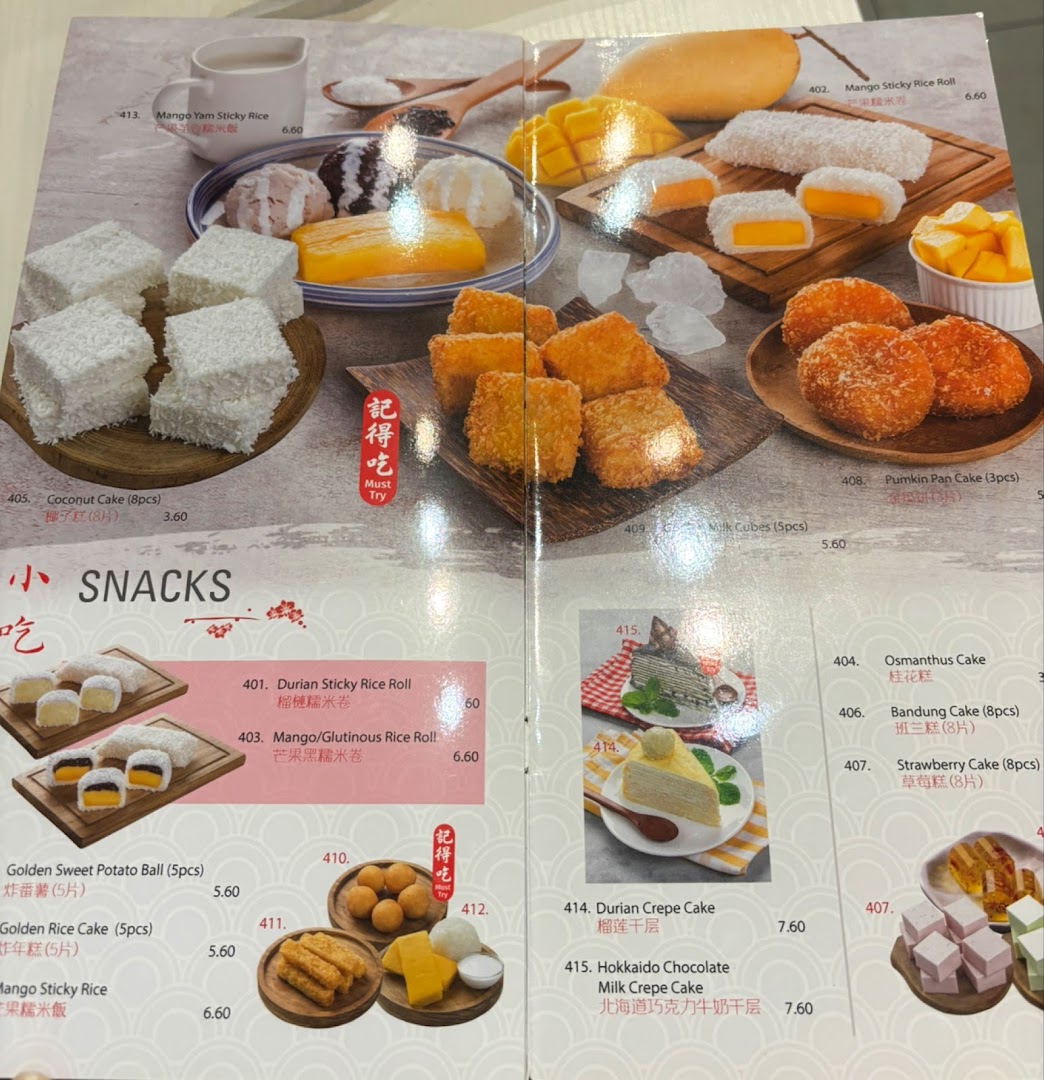 A vibrant menu displaying a variety of delicious Asian desserts and snacks with prices.