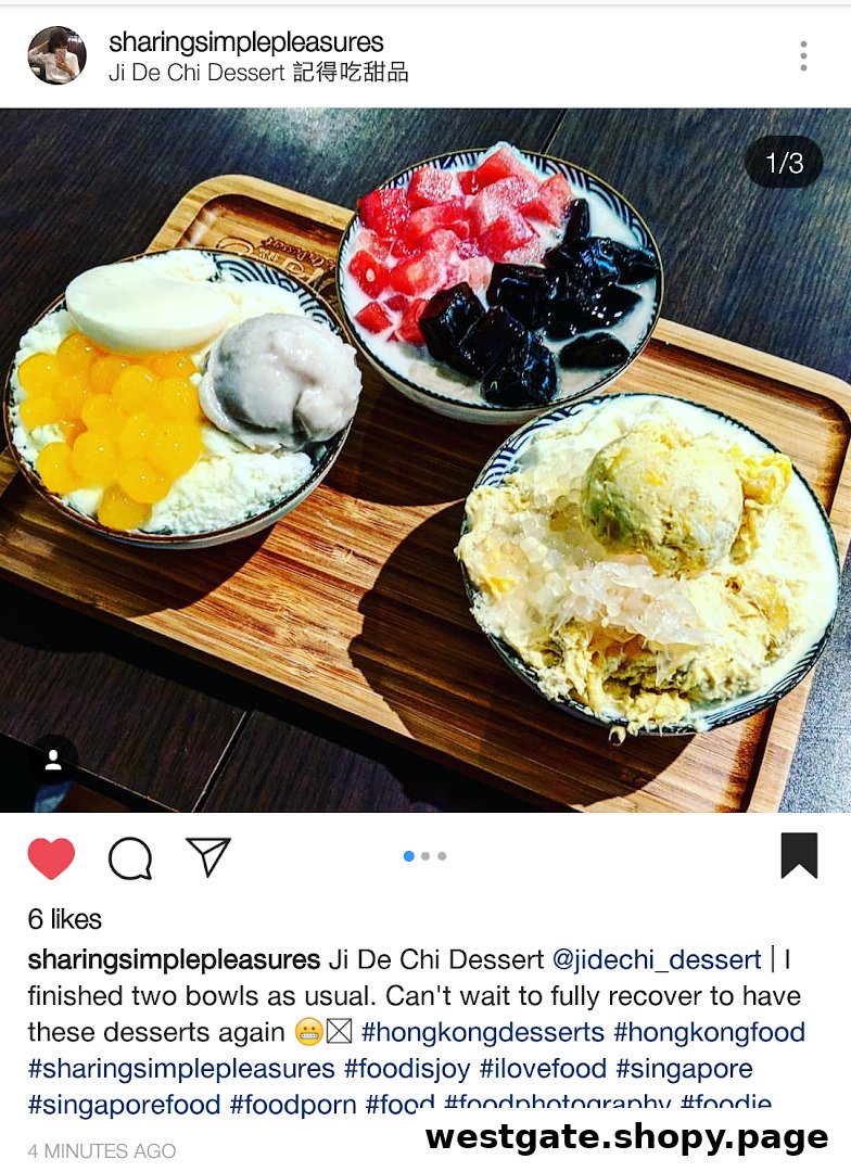 Three colorful dessert bowls with various toppings are presented on a wooden tray.