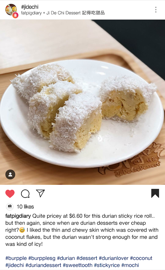 A plate of durian sticky rice rolls covered in coconut flakes from Ji De Chi Dessert.