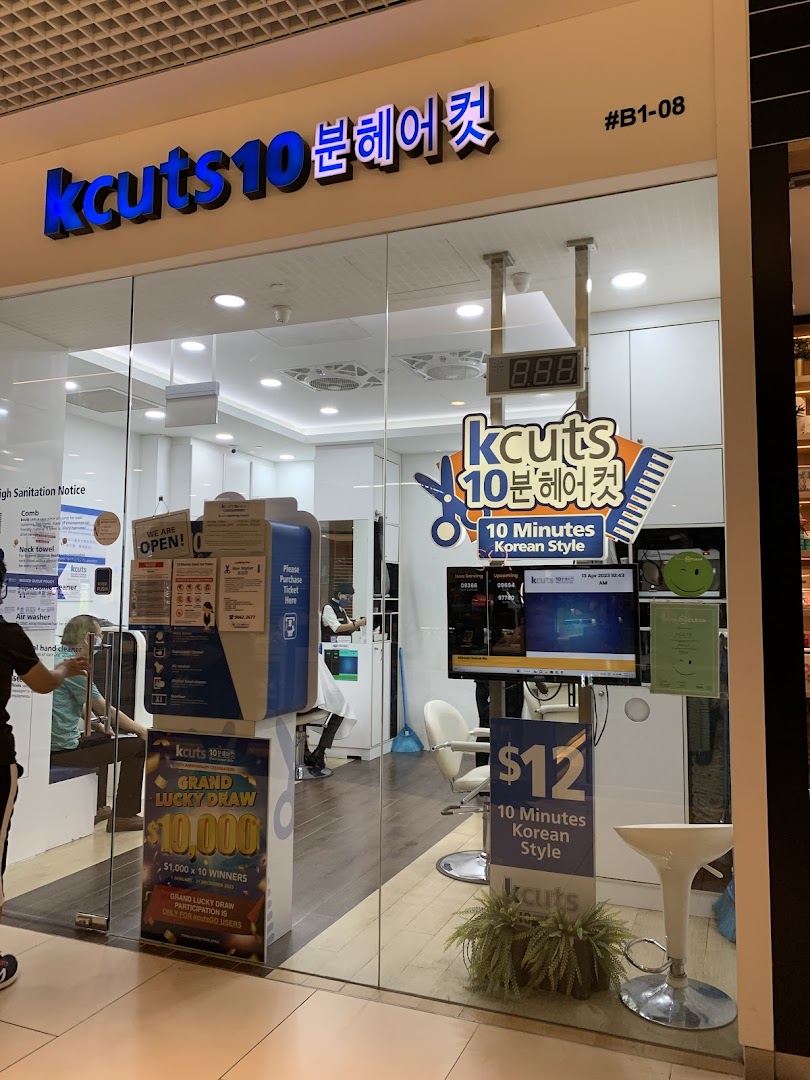 The storefront of kcuts, a hair salon offering 10-minute Korean style haircuts.