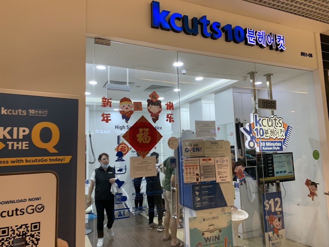 The vibrant storefront of kcuts 10 Minutes Korean Style hair salon, showcasing its entrance and interior.