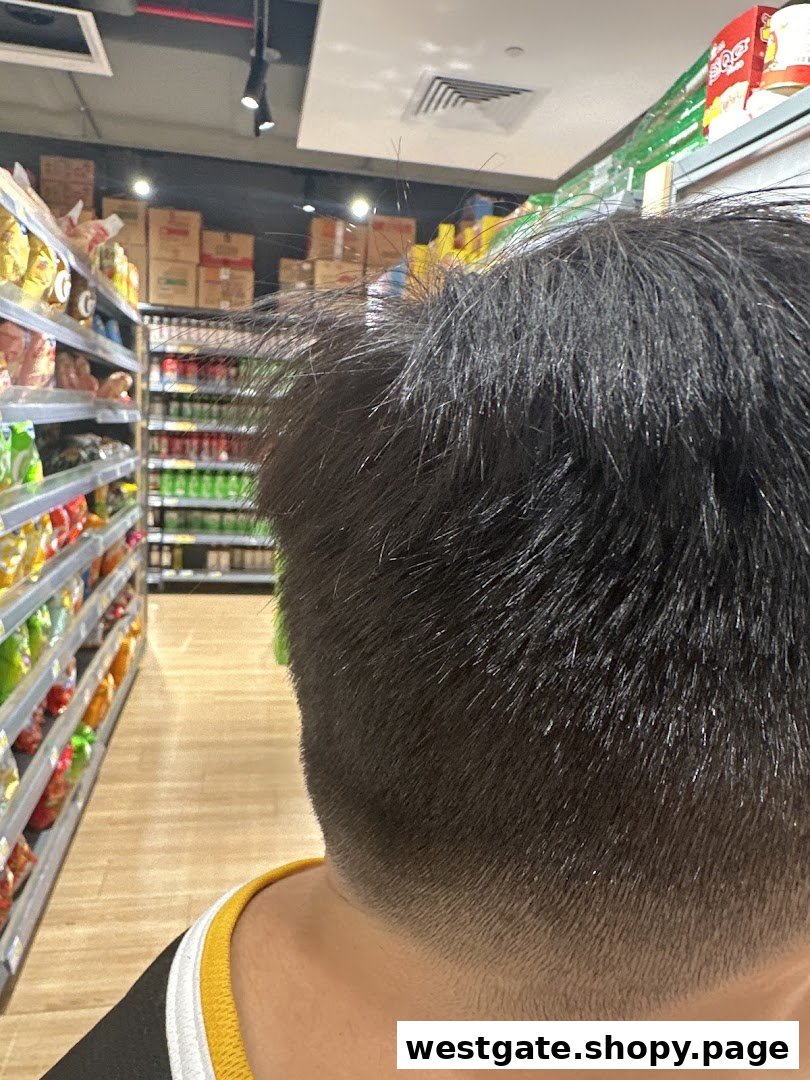 Close-up of a fresh haircut, with supermarket aisles visible in the background.