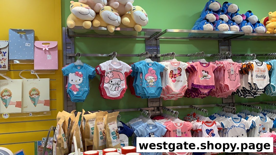 A vibrant display of baby rompers, plush toys, and gift items inside a children's store.