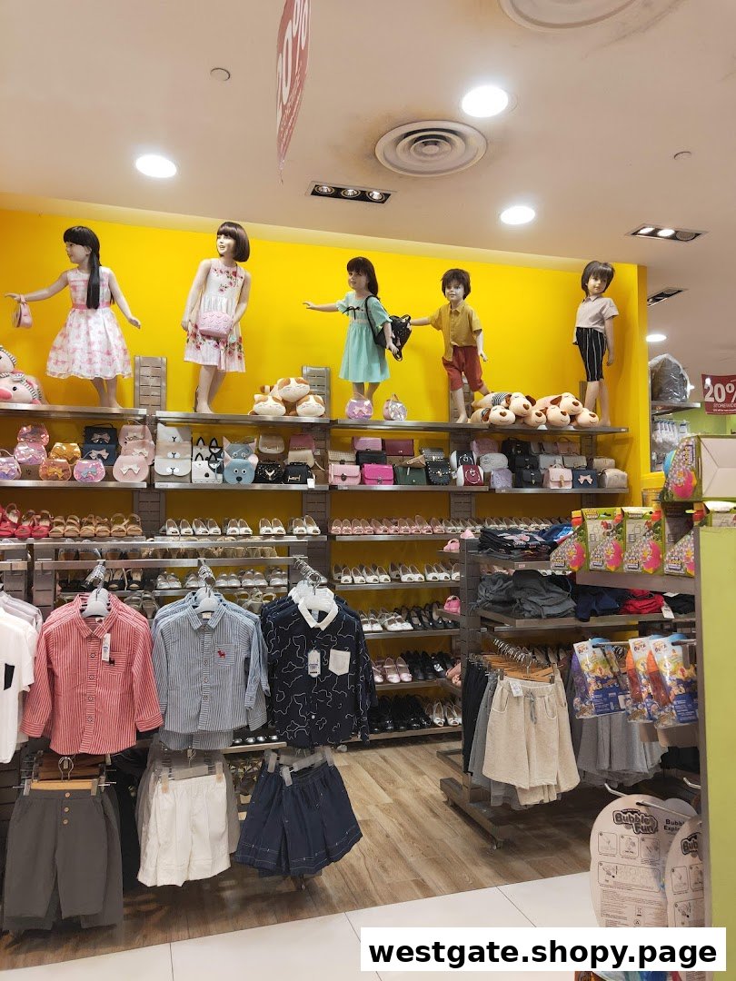 Interior view of Kiddy Palace showcasing children's apparel, shoes, and accessories on display.