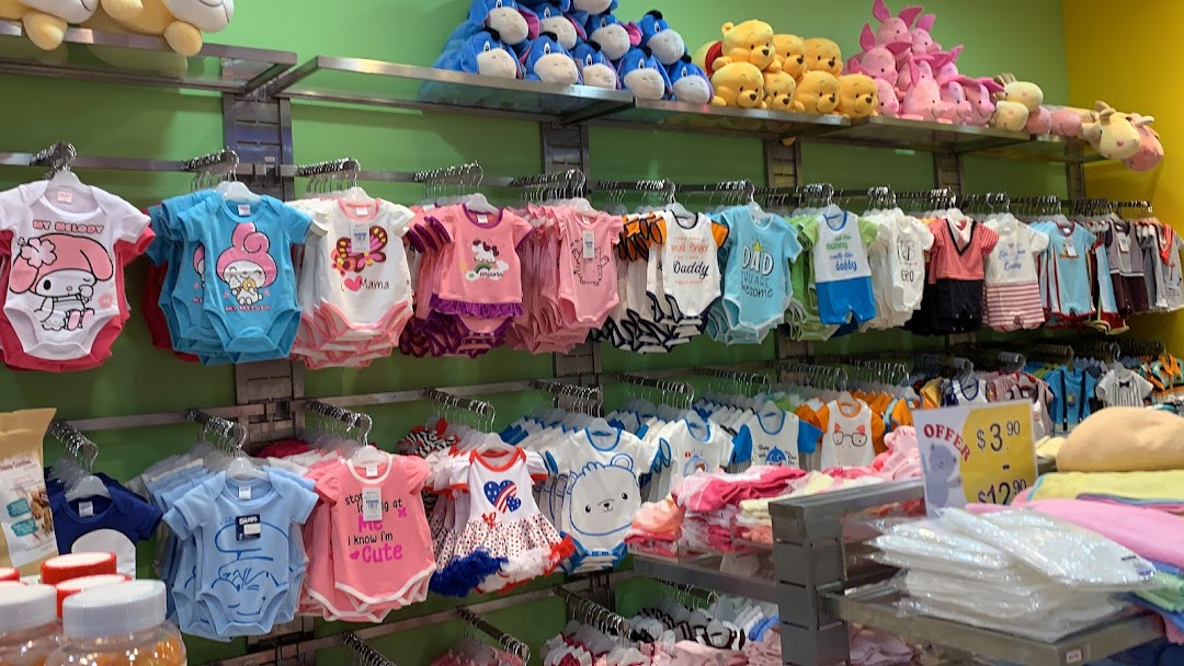 An aisle in Kiddy Palace displaying a wide selection of colorful baby rompers and plush toys.
